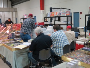 Collectors sorting through card boxes.